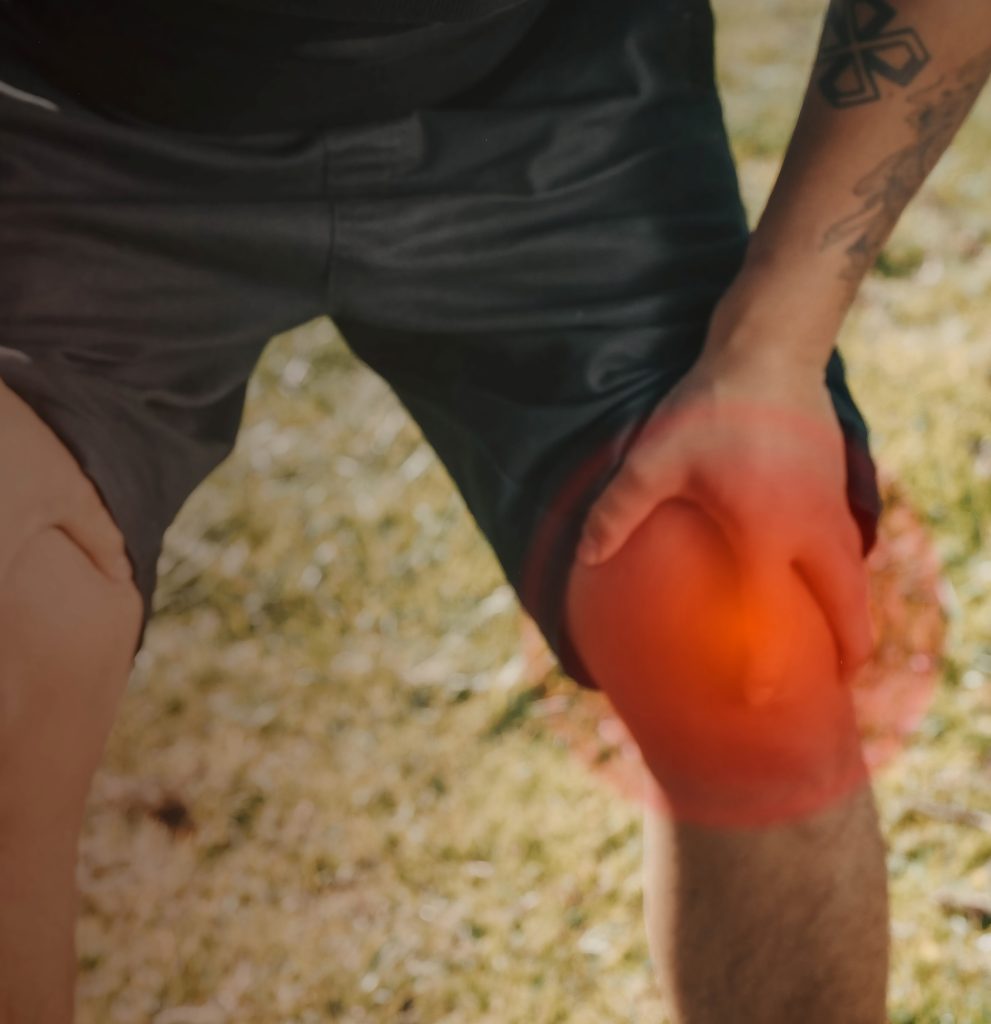 A hurt knee with joint discomfort being held out of exhaustion seeking relieving exercising.